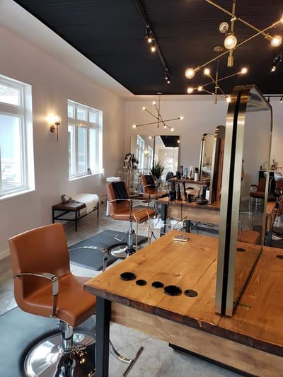 Vertical interior view of the AT.hair & co. salon.